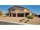 Stunning home featuring a three-car garage and desert landscaping for low-maintenance curb appeal at 7572 Mount Spokane Ct, Las Vegas, NV 89113