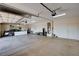 The three-car garage boasts ample space for parking and storage with custom door at 7572 Mount Spokane Ct, Las Vegas, NV 89113