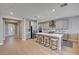 Modern kitchen featuring a large island, sleek appliances, and stylish backsplash, perfect for entertaining at 7572 Mount Spokane Ct, Las Vegas, NV 89113