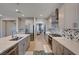 Well-lit kitchen with white cabinetry, stainless steel appliances, and stylish backsplash at 7572 Mount Spokane Ct, Las Vegas, NV 89113