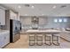 Modern kitchen featuring stainless appliances, a large island, and an open design, ideal for entertaining at 7572 Mount Spokane Ct, Las Vegas, NV 89113
