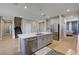 Modern kitchen featuring an island, stainless steel appliances, and open floor plan at 7572 Mount Spokane Ct, Las Vegas, NV 89113