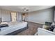 Main bedroom with neutral walls, carpeting, fan, and adjacent bath at 7572 Mount Spokane Ct, Las Vegas, NV 89113