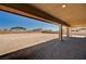 Covered patio with a patterned brick floor overlooking a large backyard at 7572 Mount Spokane Ct, Las Vegas, NV 89113