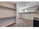 Spacious walk-in closet with wrap-around shelving and natural light from two windows at 7572 Mount Spokane Ct, Las Vegas, NV 89113
