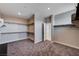 Large walk-in closet with carpet and gray walls with a doorway to another room at 7572 Mount Spokane Ct, Las Vegas, NV 89113