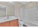 Bright bathroom featuring a shower-tub combination and a vanity with wooden cabinets at 7632 Calico Fields St, Las Vegas, NV 89149