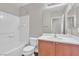 Bright bathroom featuring a shower-tub combination and a vanity with wooden cabinets at 7632 Calico Fields St, Las Vegas, NV 89149