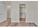 This is a bedroom with wood floors and a closet featuring sliding doors and fresh paint at 7632 Calico Fields St, Las Vegas, NV 89149