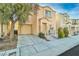 Two-story home with an attached garage, small porch, and well-kept front yard at 7632 Calico Fields St, Las Vegas, NV 89149