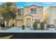 Charming two-story home with a well-maintained front yard and attached garage at 7632 Calico Fields St, Las Vegas, NV 89149