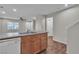 Kitchen featuring a sink with stainless steel appliances and wood cabinets at 7632 Calico Fields St, Las Vegas, NV 89149