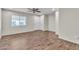Spacious living room featuring wood-look tile flooring and ample natural light at 7632 Calico Fields St, Las Vegas, NV 89149