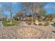 This is a community park playground featuring trees and a grassy area at 7632 Calico Fields St, Las Vegas, NV 89149