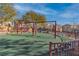 Swings in a well-maintained community playground, providing a safe and enjoyable space for children to play at 7632 Calico Fields St, Las Vegas, NV 89149