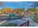 Community playground with a red-roofed gazebo and fun spring riders for to enjoy the outdoors at 7632 Calico Fields St, Las Vegas, NV 89149