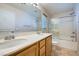 Bright bathroom featuring a double sink vanity and a shower-tub combo with sliding glass doors at 765 Jewel Tower St, Las Vegas, NV 89178
