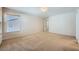 Neutral carpeted bedroom with natural light and an open doorway at 765 Jewel Tower St, Las Vegas, NV 89178