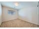 An empty bedroom with neutral walls, carpeted flooring and a window with blinds at 765 Jewel Tower St, Las Vegas, NV 89178