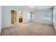 Spacious bedroom with carpet, natural light, a large closet, and a private bathroom at 765 Jewel Tower St, Las Vegas, NV 89178
