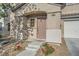 Inviting front entrance with a covered porch, well-kept landscaping, and a visible house number at 765 Jewel Tower St, Las Vegas, NV 89178
