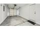 A clean, spacious garage with a roll-up door and access door provides secure parking and storage at 765 Jewel Tower St, Las Vegas, NV 89178