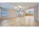 Spacious open-concept living room with tile flooring, a ceiling fan, and views of the kitchen at 765 Jewel Tower St, Las Vegas, NV 89178