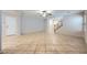 The house's expansive living room with tile flooring, neutral-toned walls, ceiling fan and natural light at 765 Jewel Tower St, Las Vegas, NV 89178