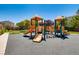 A colorful playground with slides and climbing structures provides a fun and safe play area at 765 Jewel Tower St, Las Vegas, NV 89178