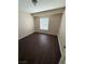 This bedroom features a window and sleek flooring, offering a simple design that maximizes space and comfort at 7969 Cina Ave, Las Vegas, NV 89147