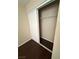A modern sliding door closet with white doors and an inside shelf maximizing storage space with a minimalist design at 7969 Cina Ave, Las Vegas, NV 89147