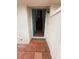 The entryway of the house has tile flooring that leads to a wooden staircase at 7969 Cina Ave, Las Vegas, NV 89147