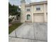 A two-story townhome with a private driveway and an attached one-car garage at 7969 Cina Ave, Las Vegas, NV 89147