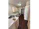 The kitchen includes light wood cabinets, white appliances, and matching countertops at 7969 Cina Ave, Las Vegas, NV 89147