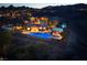 Aerial view showcases a backyard oasis with a sparkling pool, spa, and outdoor entertaining space at 8 Laricola Ct, Henderson, NV 89011