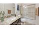 Well-lit bathroom with granite vanity and shower/tub combination at 8 Laricola Ct, Henderson, NV 89011