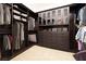 Walk-in closet with custom shelving and ample storage space for clothes and accessories at 8 Laricola Ct, Henderson, NV 89011