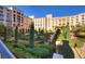 Beautiful landscaped courtyard with manicured gardens and elegant architecture at 8 Laricola Ct, Henderson, NV 89011