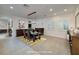 Elegant dining room featuring modern lighting, neutral walls and floors, and stylish furniture at 8 Laricola Ct, Henderson, NV 89011