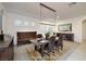 Elegant dining room with contemporary lighting, setting a scene for stylish dining at 8 Laricola Ct, Henderson, NV 89011