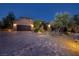 Beautiful home exterior features a paved brick driveway leading to a spacious two-car garage at 8 Laricola Ct, Henderson, NV 89011