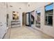 Bright foyer with high ceilings, neutral tones, and an open doorway to a cozy outdoor patio at 8 Laricola Ct, Henderson, NV 89011