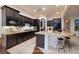 Modern kitchen featuring granite countertops, stainless steel appliances and tile backsplash at 8 Laricola Ct, Henderson, NV 89011