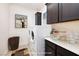 Well-organized laundry room with modern washer and dryer, ample storage, and stylish decor at 8 Laricola Ct, Henderson, NV 89011