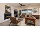 Bright and modern living room with a fireplace and views of the outdoors at 8 Laricola Ct, Henderson, NV 89011