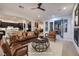 Cozy living room featuring modern furniture and design that opens to the kitchen and dining room at 8 Laricola Ct, Henderson, NV 89011