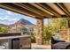 Outdoor kitchen with mountain views and seating area at 8 Laricola Ct, Henderson, NV 89011