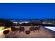 Outdoor seating at night with mountain and city views in the background at 8 Laricola Ct, Henderson, NV 89011
