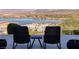 Outdoor patio featuring modern patio furniture overlooking lake and mountain views at 8 Laricola Ct, Henderson, NV 89011