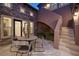 Charming outdoor patio featuring stylish seating and lush greenery at 8 Laricola Ct, Henderson, NV 89011